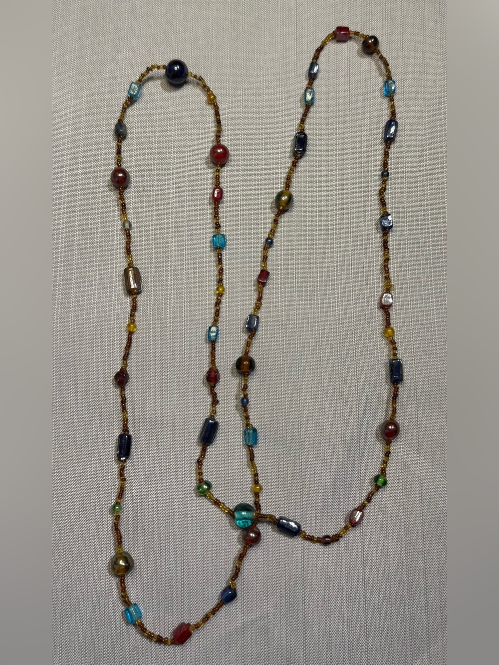 Long multicoloured glass beaded necklace